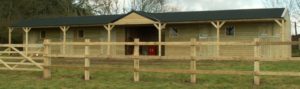 fixed timber stable block with centre hay barn