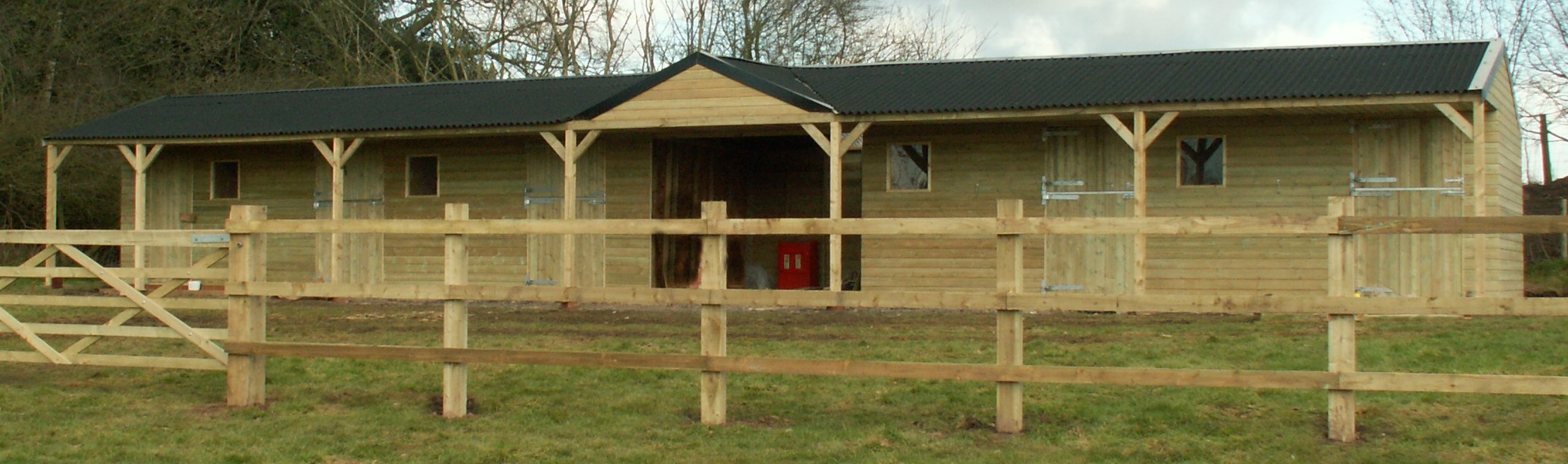 fixed timber stable block with centre hay barn